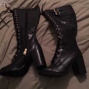 Black brand new laced up boots. Very sexy